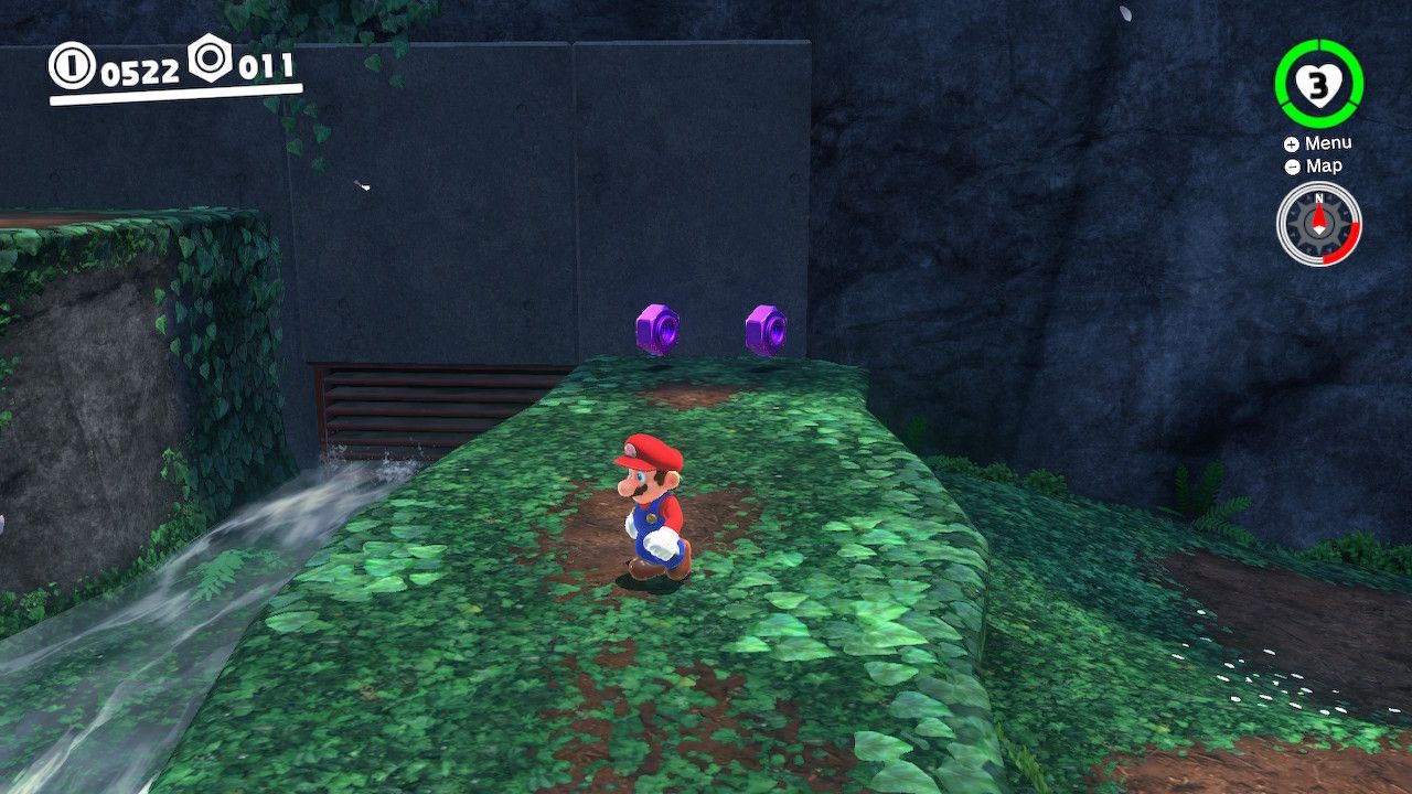 Mario standing on a platform with purple coins in the background in the Woodeed Kingdom in Super Mario Odyssey.
