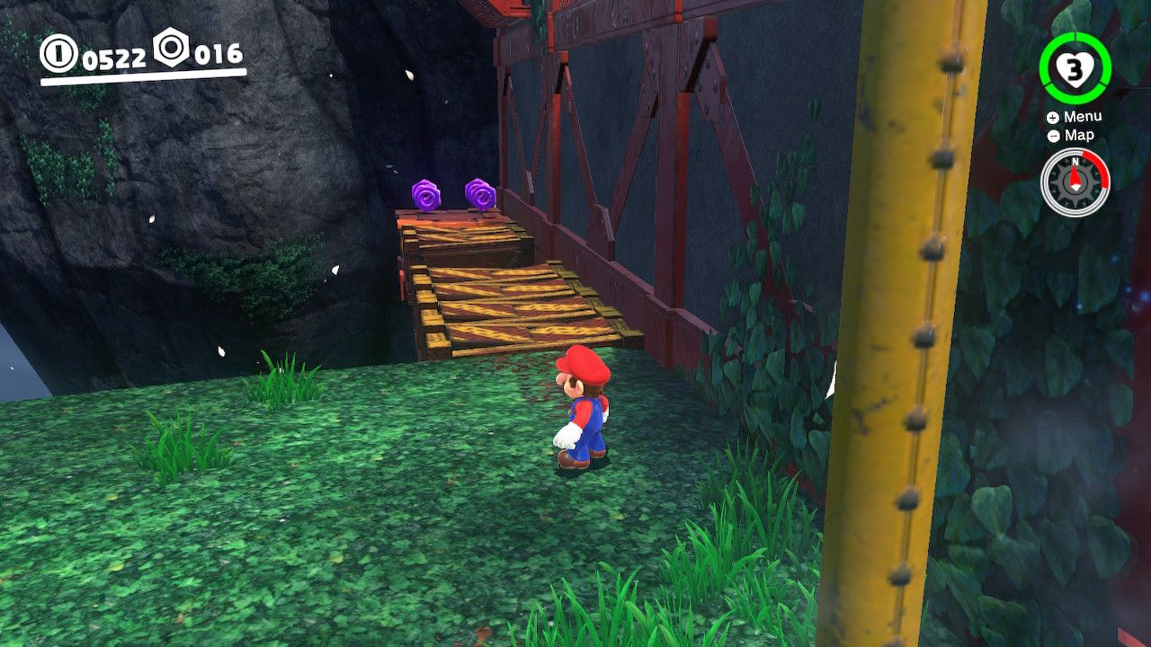 Mario standing in front of collapsible platforms with purple coins on them in the Wooded Kingdom in Super Mario Odyssey.