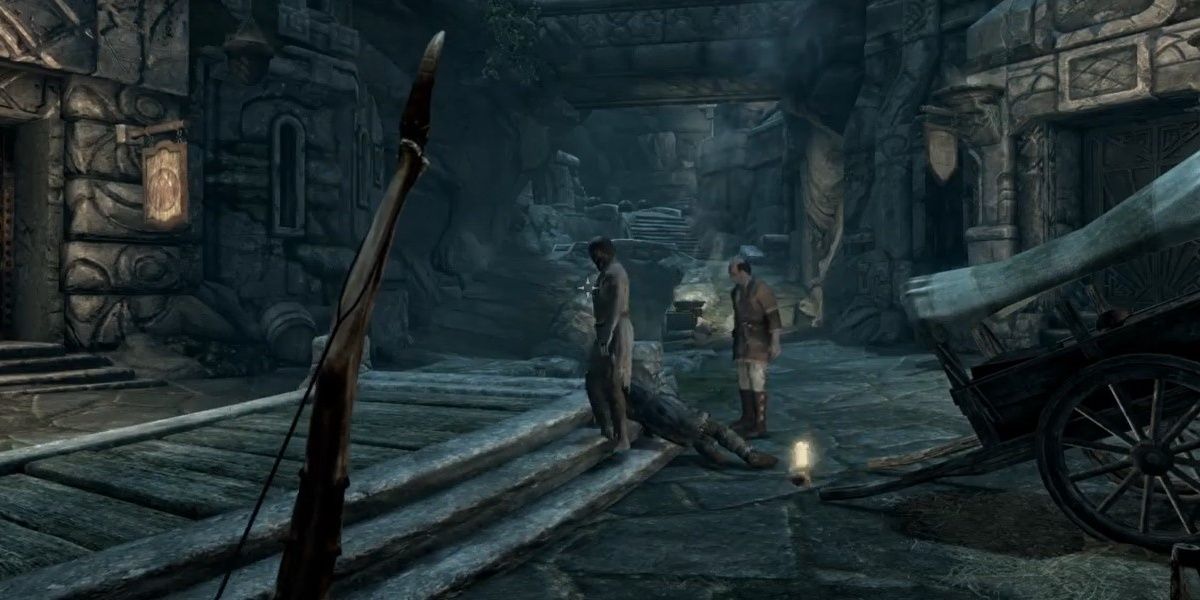 villagers investigating a body in Skyrim