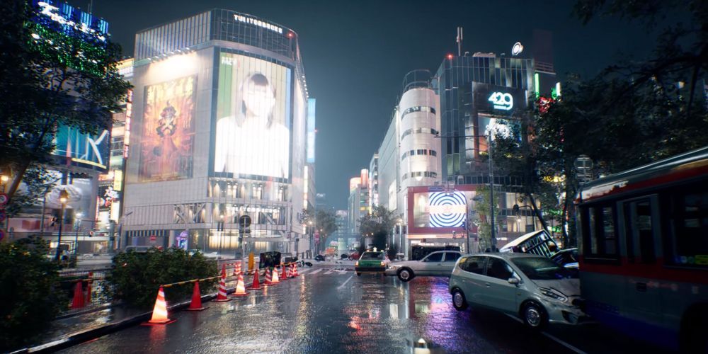 The abandoned streets of Tokyo with cars across the street, and lit up screens and billboards across buildings 
