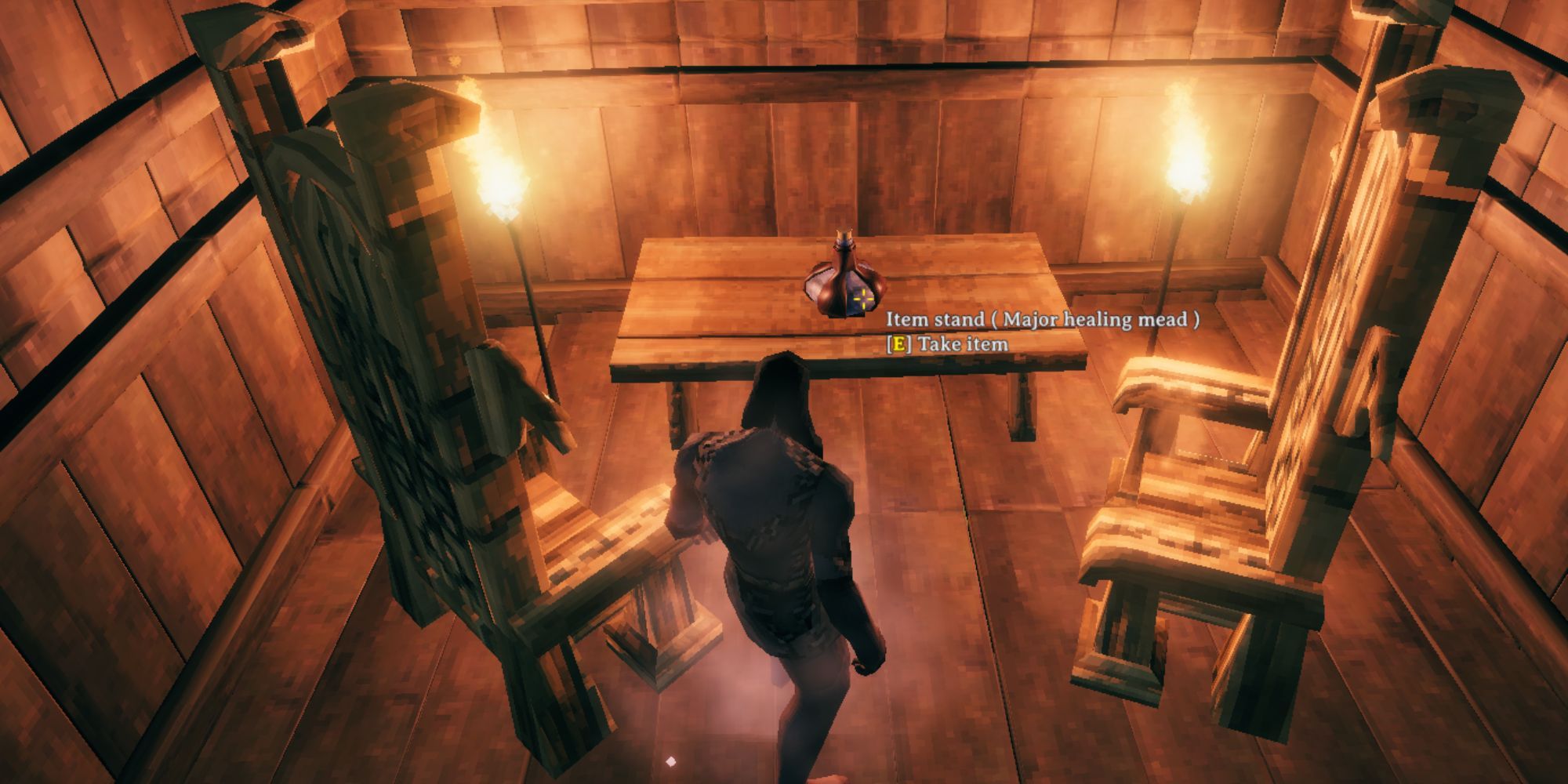 Valheim character in a Viking house in front of Major Healing Mead