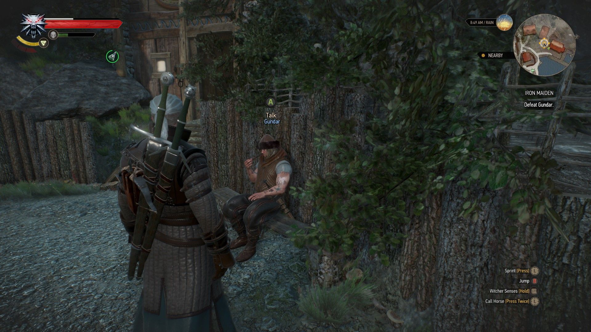 A screenshot of Geralt looking at a Skelliger sitting on a bench at an arena in a village.
