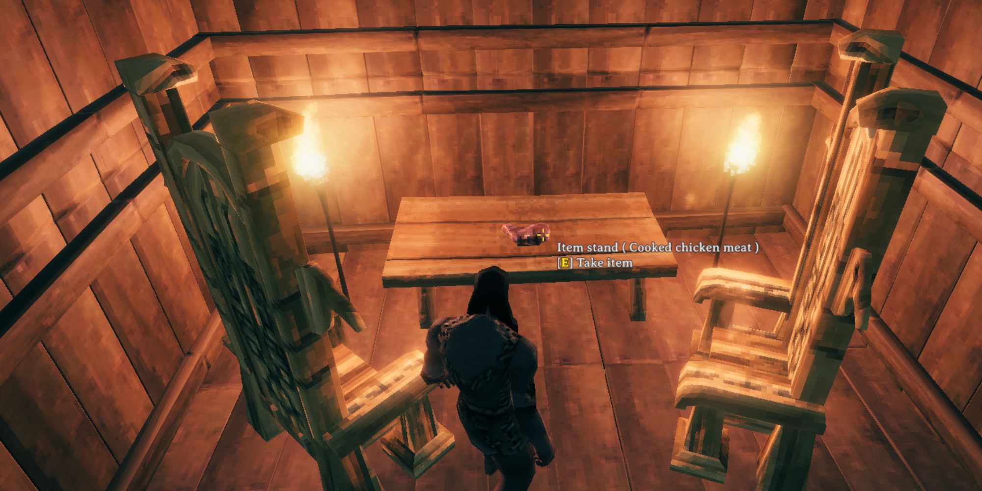 Valheim character in a Viking house in front of Cooked Chicken Meat