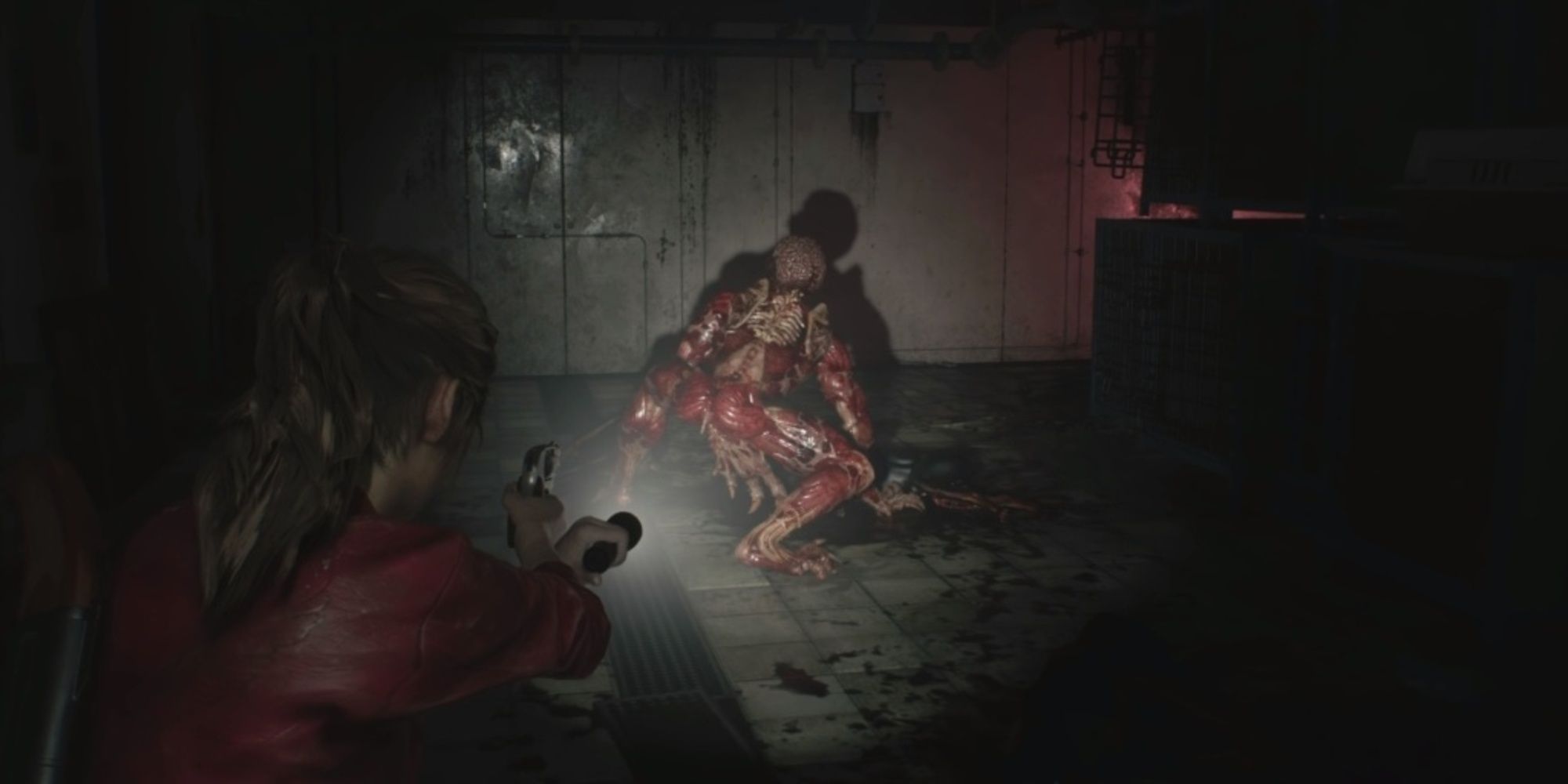 Claire Redfield aims a gun at a licker in Resident Evil 2 