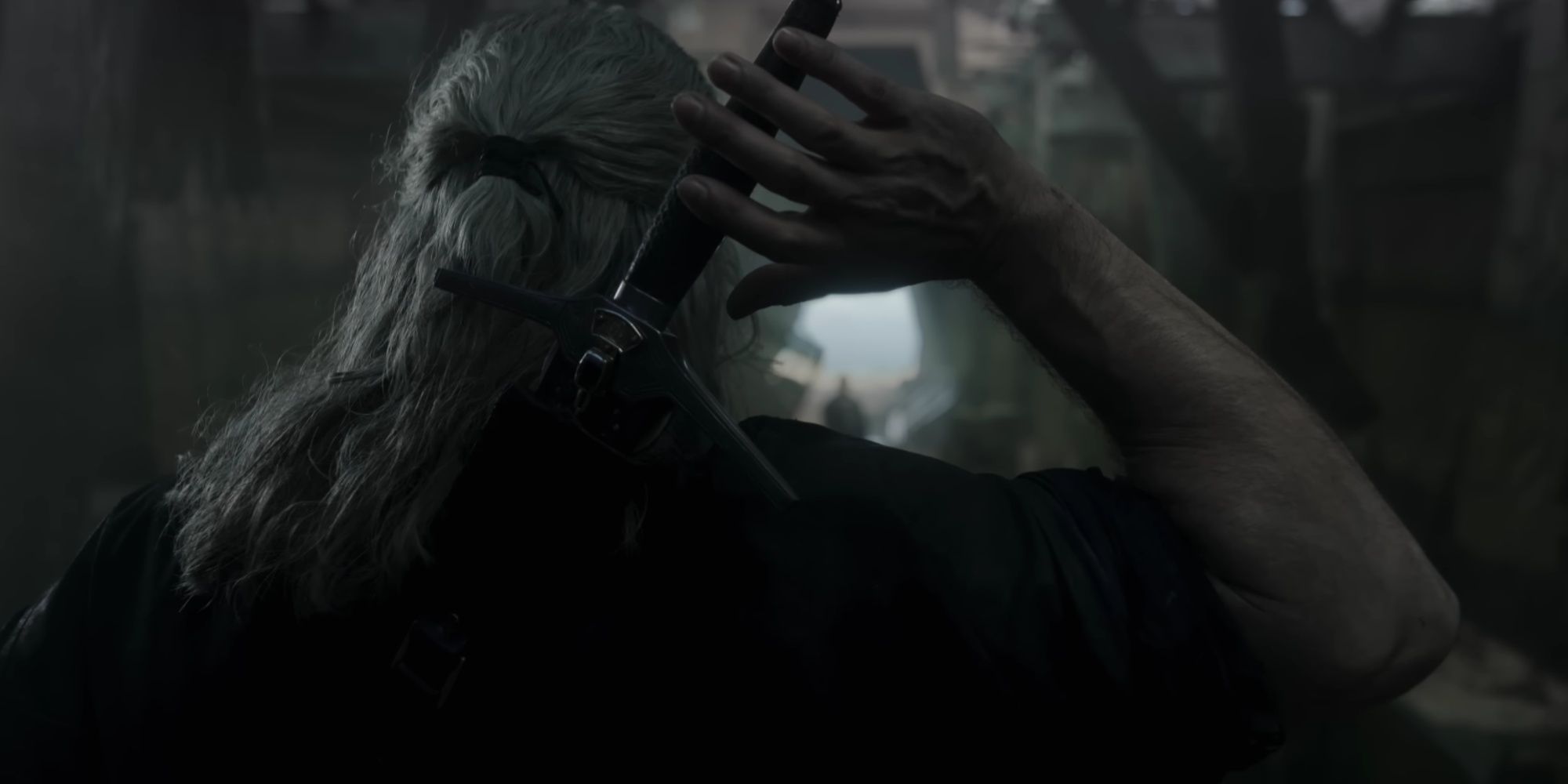 geralt reaching for his sword in the witcher