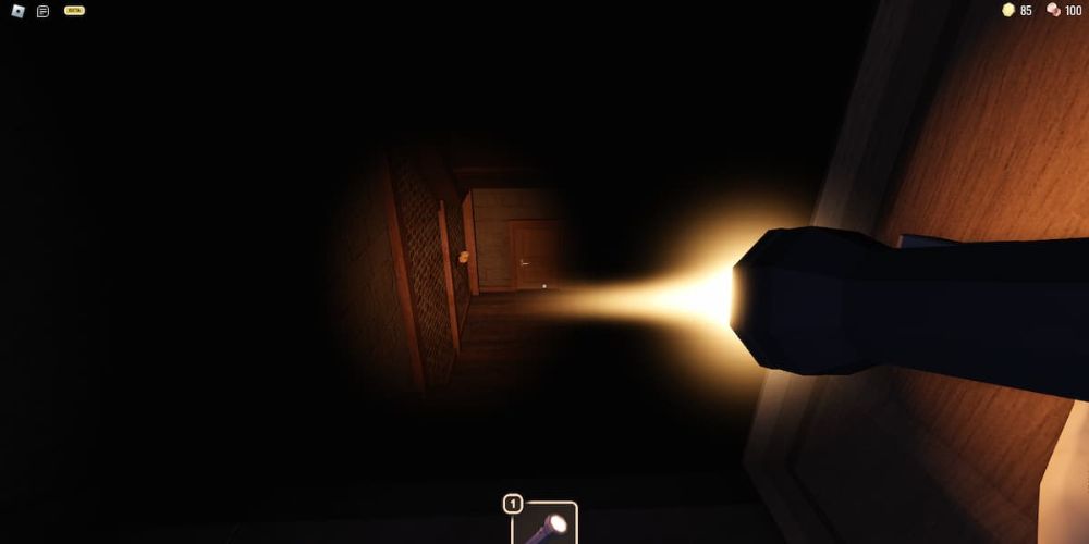 Flashlight illuminating the stairs down in doors