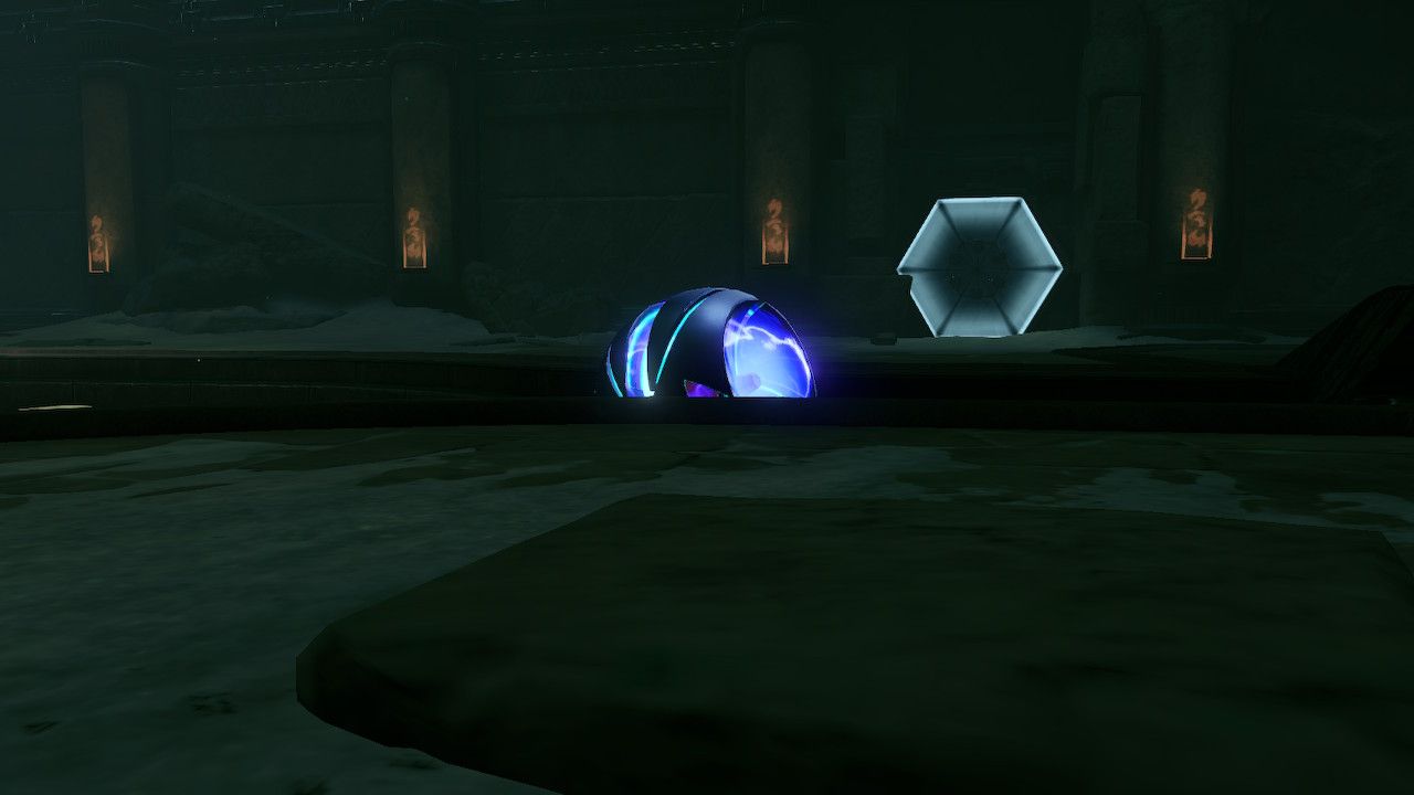 Samus in skee-ball mode rolling towards some Chozo gadgetry.