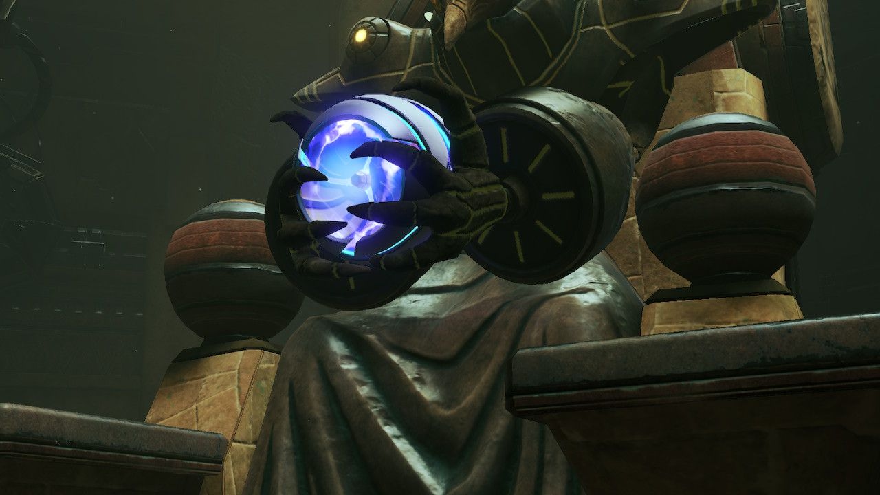 Samus sits in a Chozo statue's hands, ready to roll through some tubes.