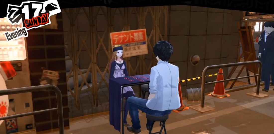joker and chihaya sitting at her fortune table in shinjuku so joker can get a reading in persona 5 royal