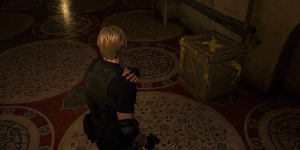leon kennedy near a crate in the ballroom in resident evil 4 remake