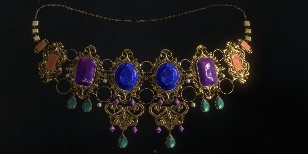an ornate necklace in resident evil 4 remake inlaid with two sapphires and two alexandrites