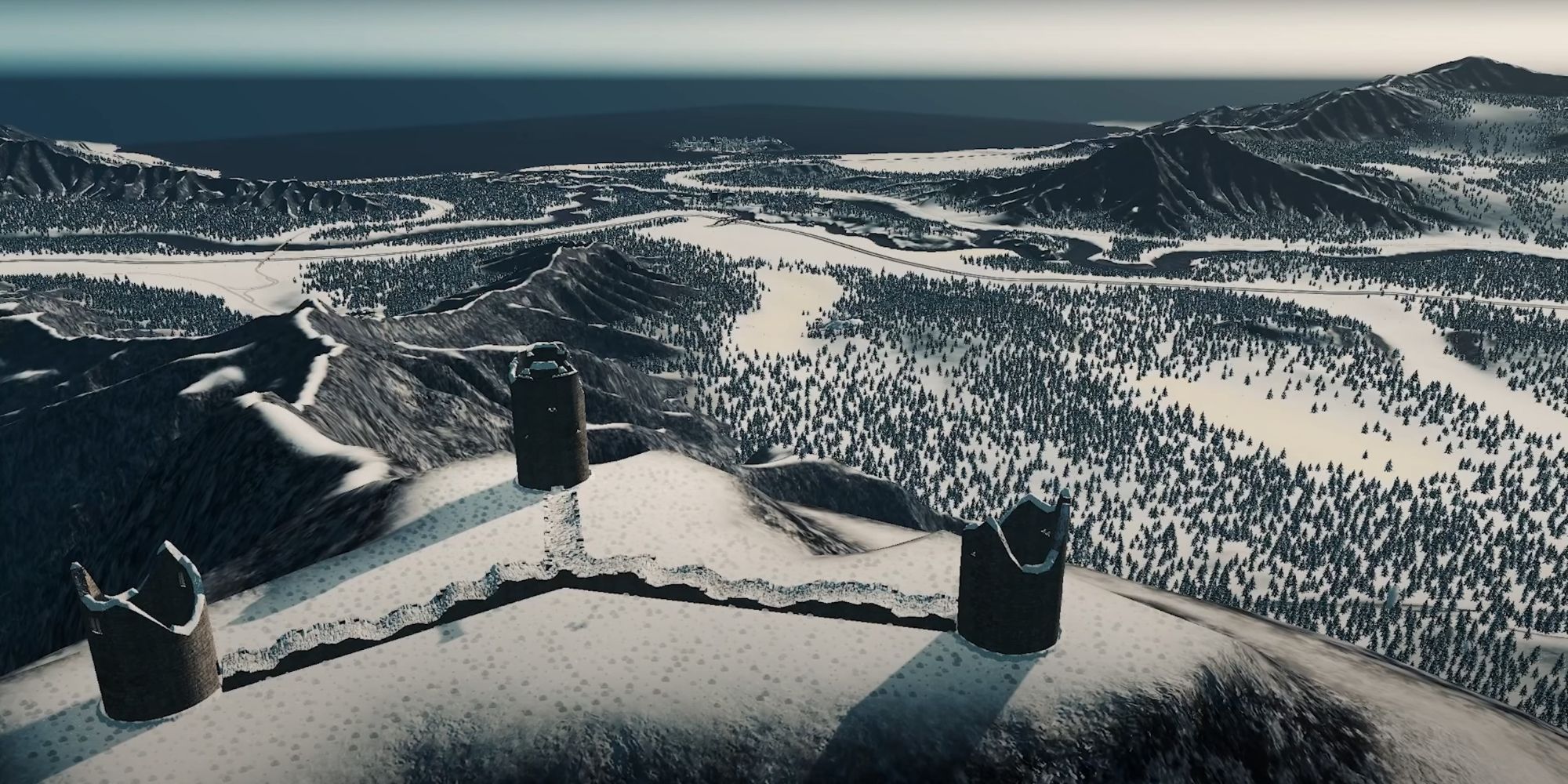 An image of the Frozenshire map from the Cities: Skylines Snowfall DLC. This map features sweeping mountains and a coast, all covered in snow.