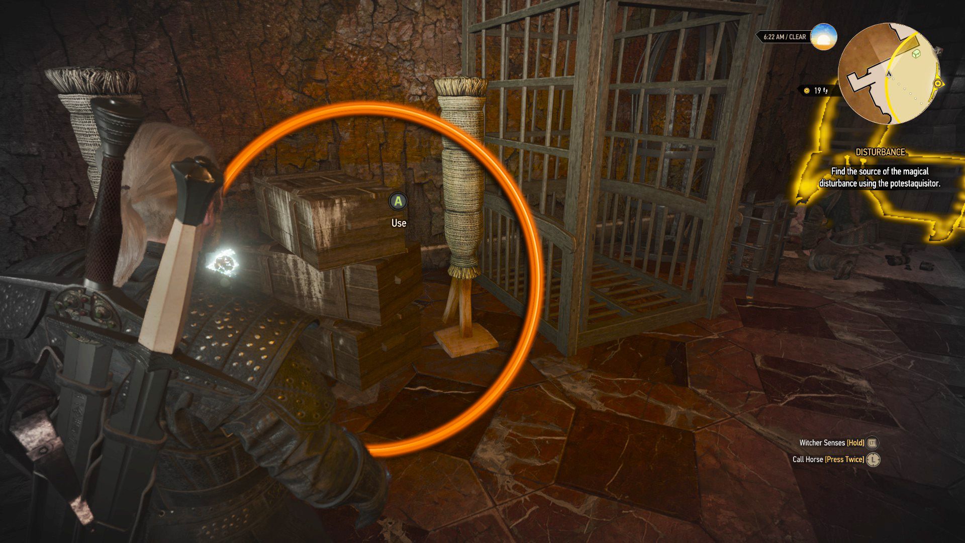 An edited screenshot from The Witcher 3, with an orange circle over a crate.