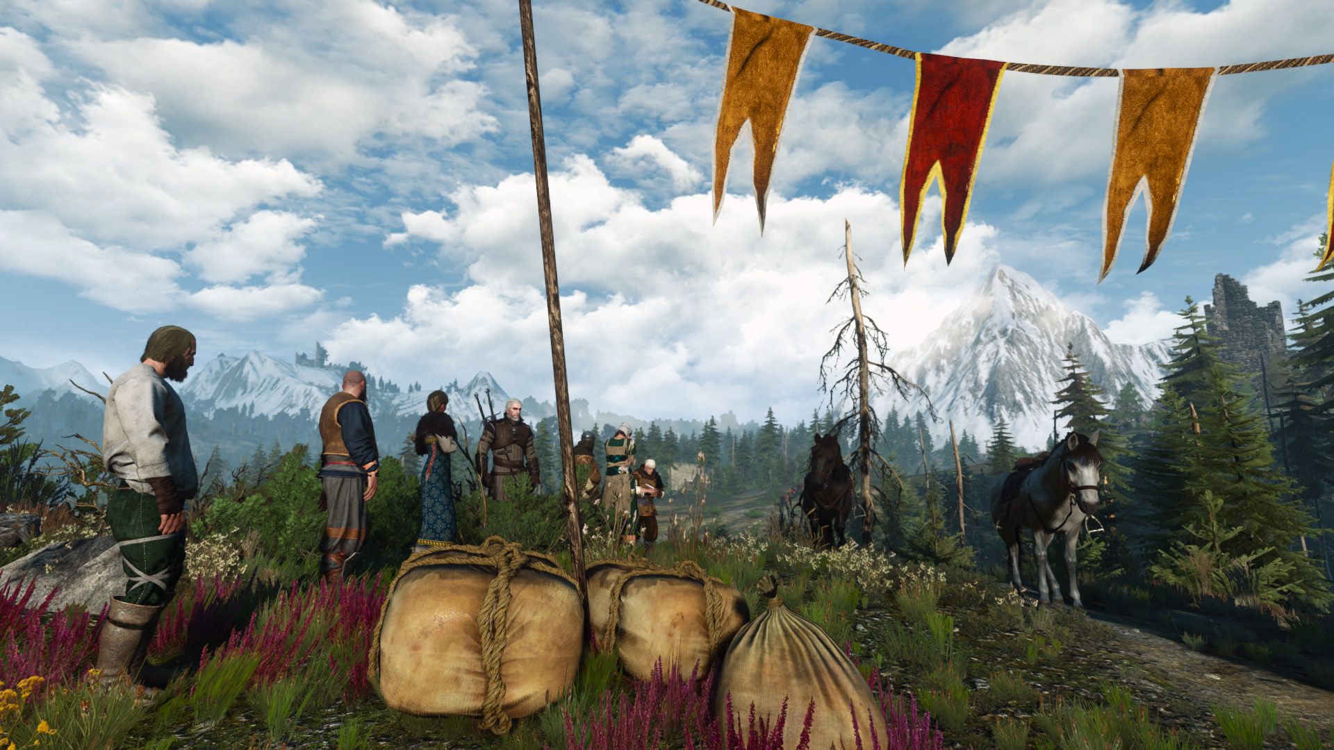 A crowd of Skelligers line up on a scenic hill, waiting for a race to start.