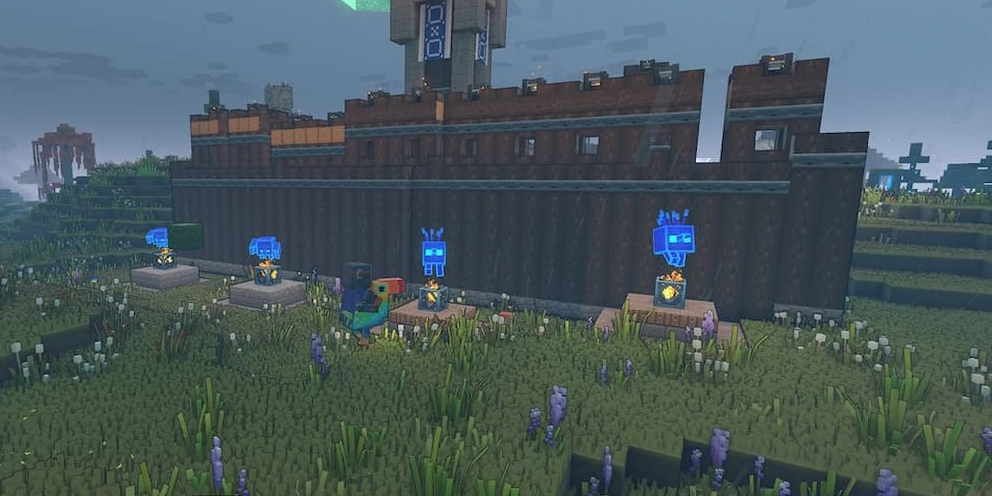 Four unit spawners sit close together outside the wall of a village in Minecraft Legends.