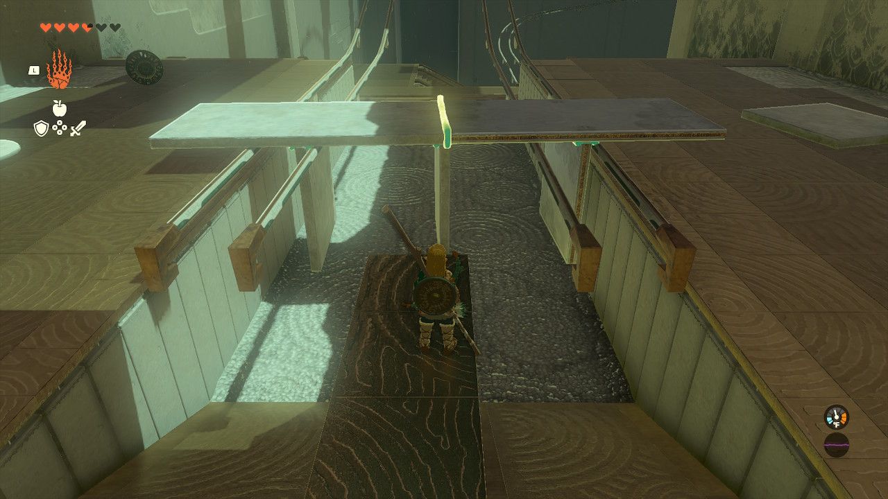 Link Looks At Metal Contraption Of Two Us Placed Stationary On Rails