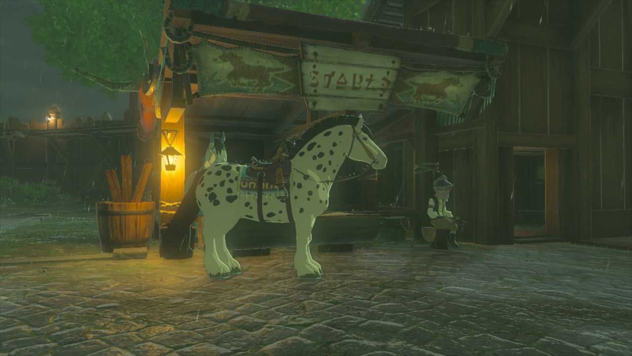 Spot Poses In Front Of Mini Stable With Lester