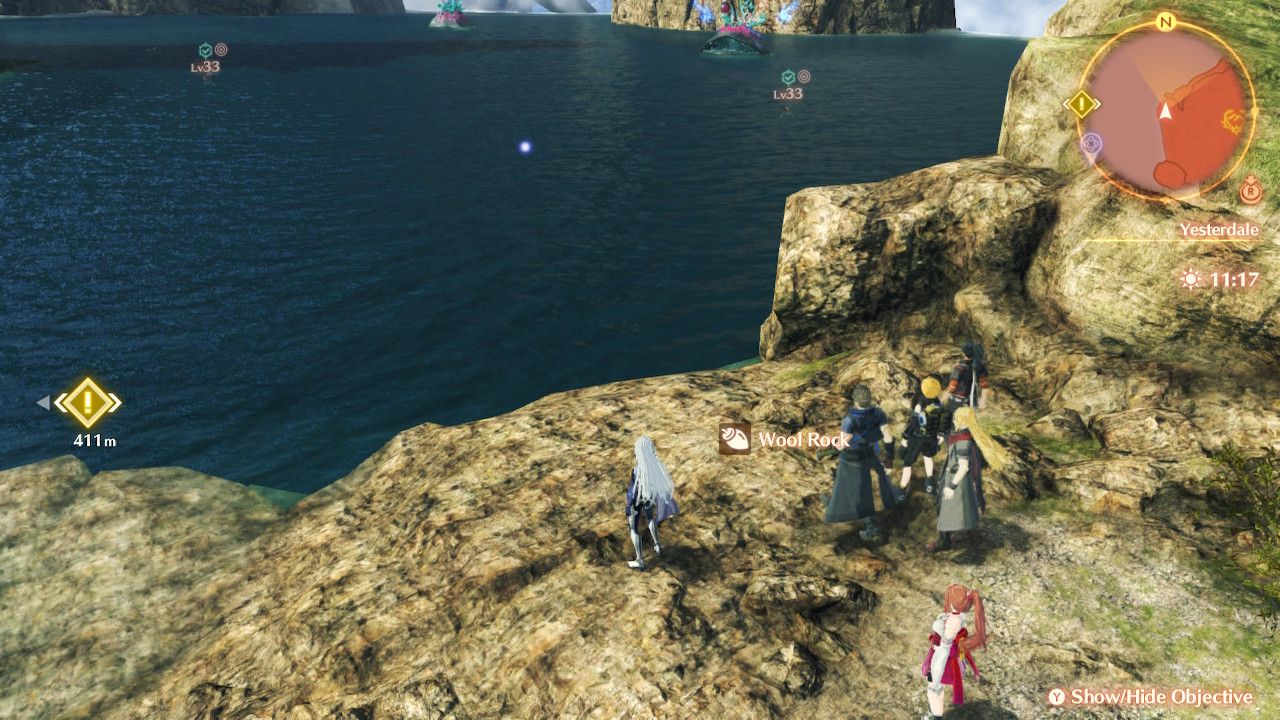 A picks up a Woll Rock with Rex, Nikol, Shulk, and Glimmer nearby in Xenoblade Chronicles 3: Future Redeemed.