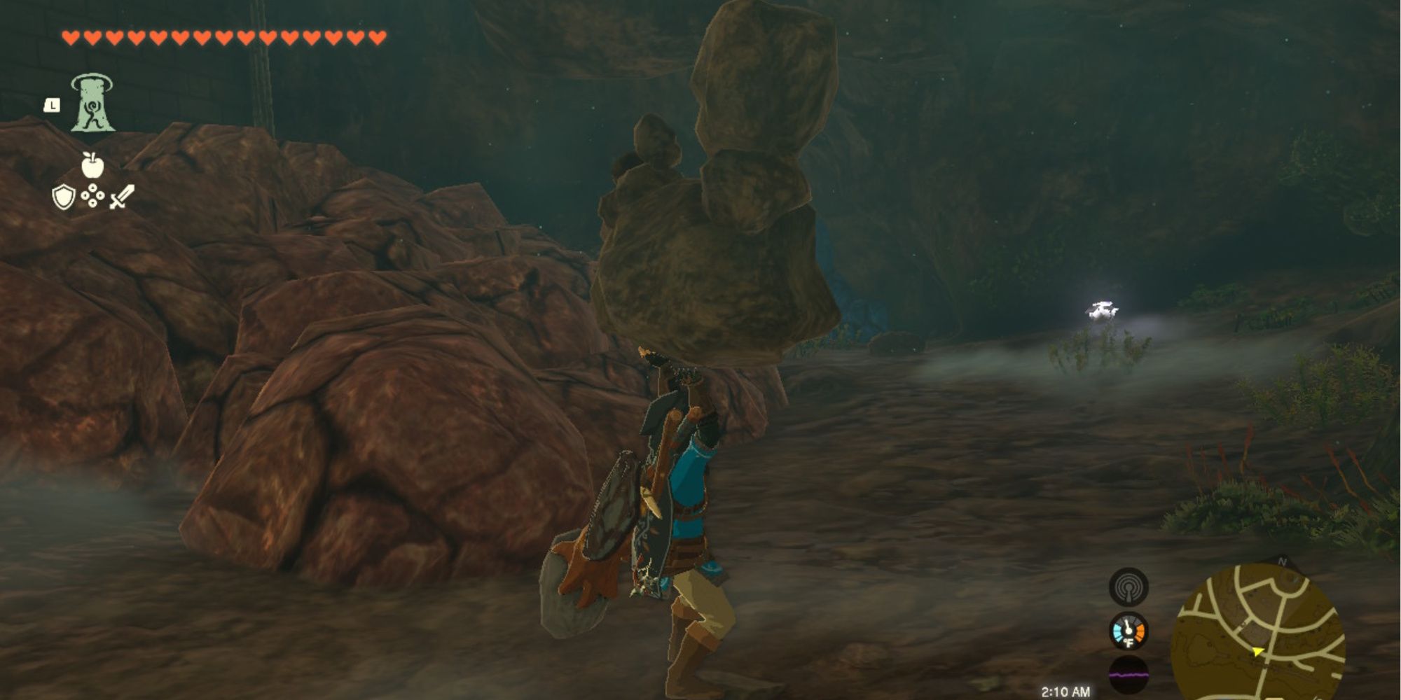 the legend of zelda tears of the kingdom, link about to throw a stone pebblitt in a cave