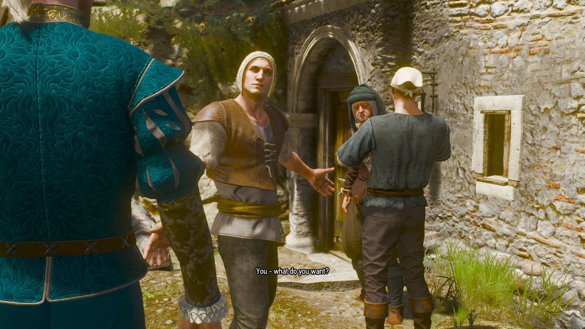 A man squares up against Geralt as they argue outside a house in Toussaint.