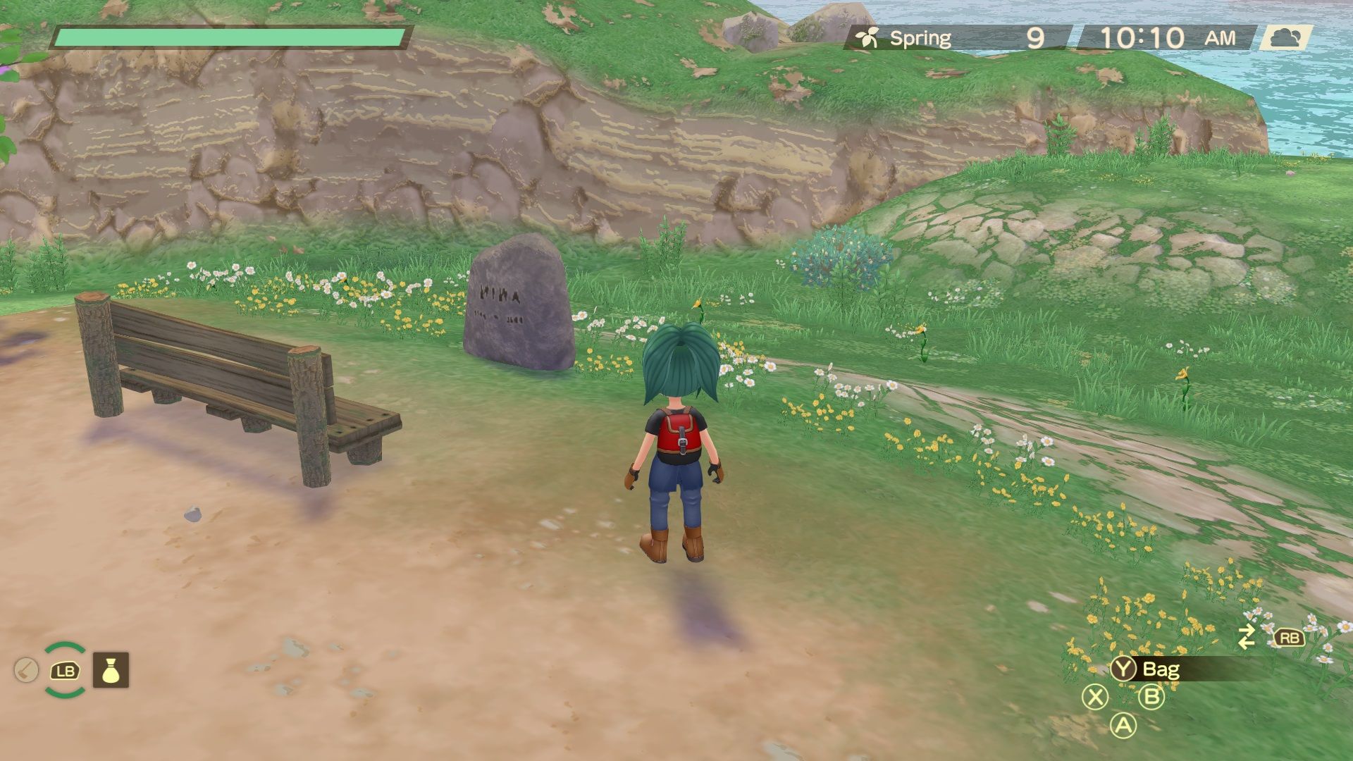 A player near Nina's grave in Story of Seasons A Wonderful Life.
