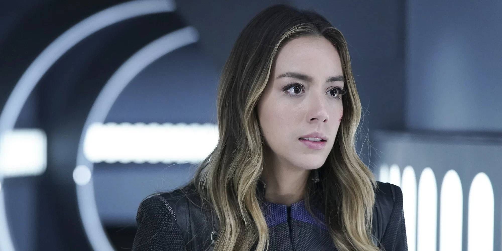 Chloe Bennet as Quake from Agents of Shield standing in a well-lit hallway