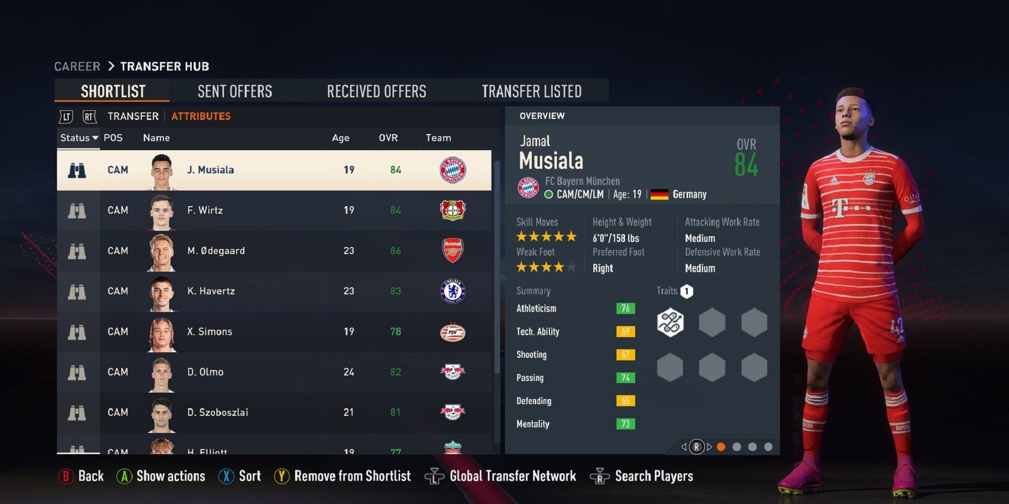 Jamal Musiala standing next to his attribute card in FIFA 23.