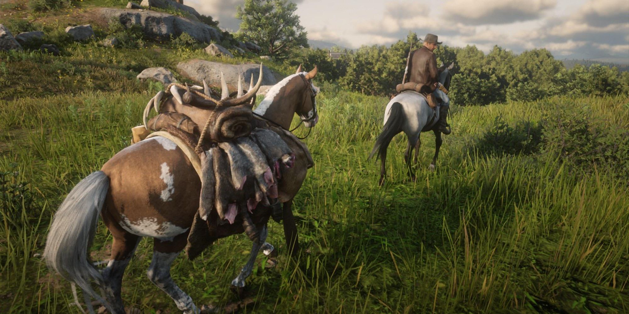 An image of a horse carrying a collection of different animal pelts in Red Dead Online