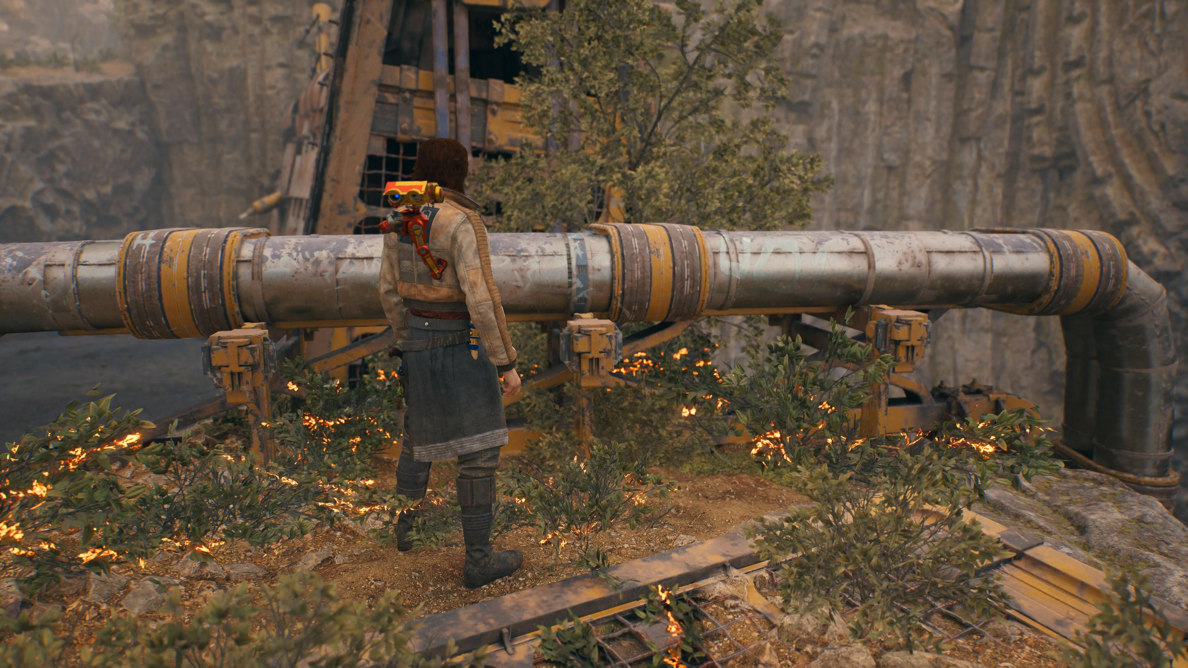Cal in front of a BD-1 scan point with pipes at the tar pit in Jedi Survivor