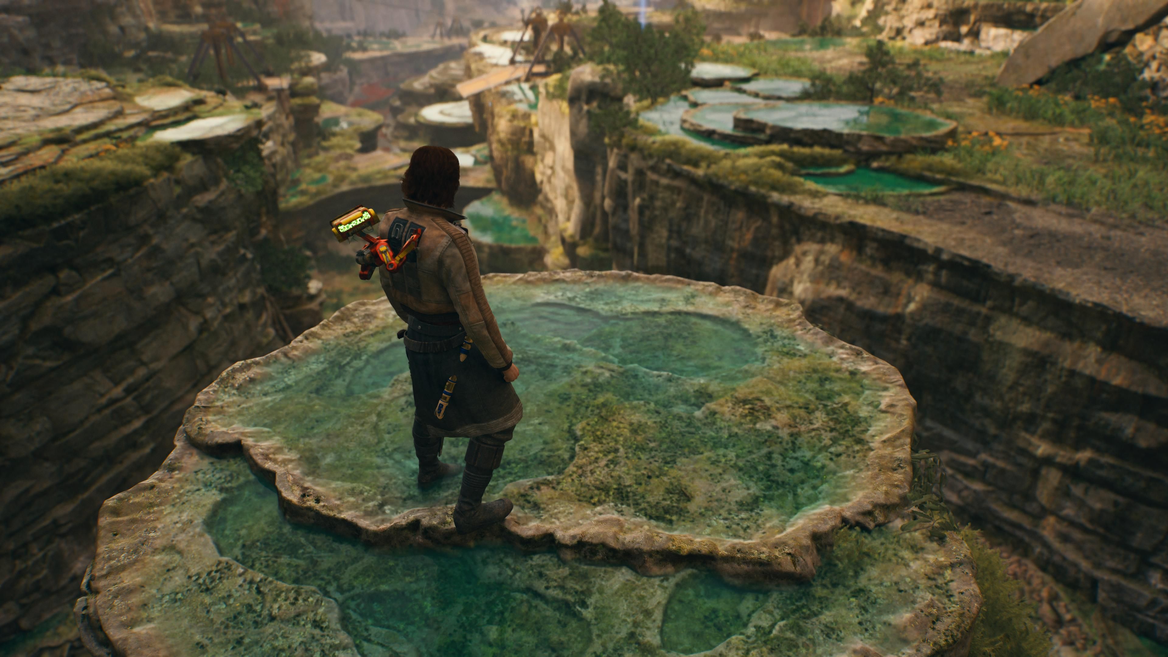 Cal standing on a rocky pillar collecting priorite in Jedi Survivor