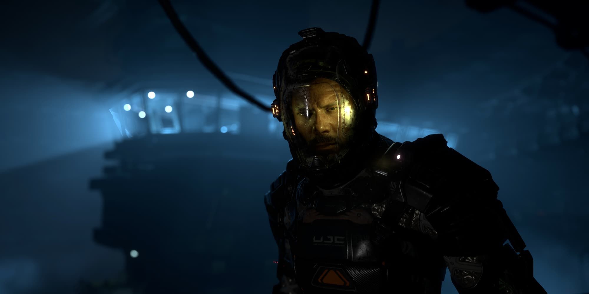 The main character stands in a room with a watchtower as he wears a space suit in The Callisto Protocol.