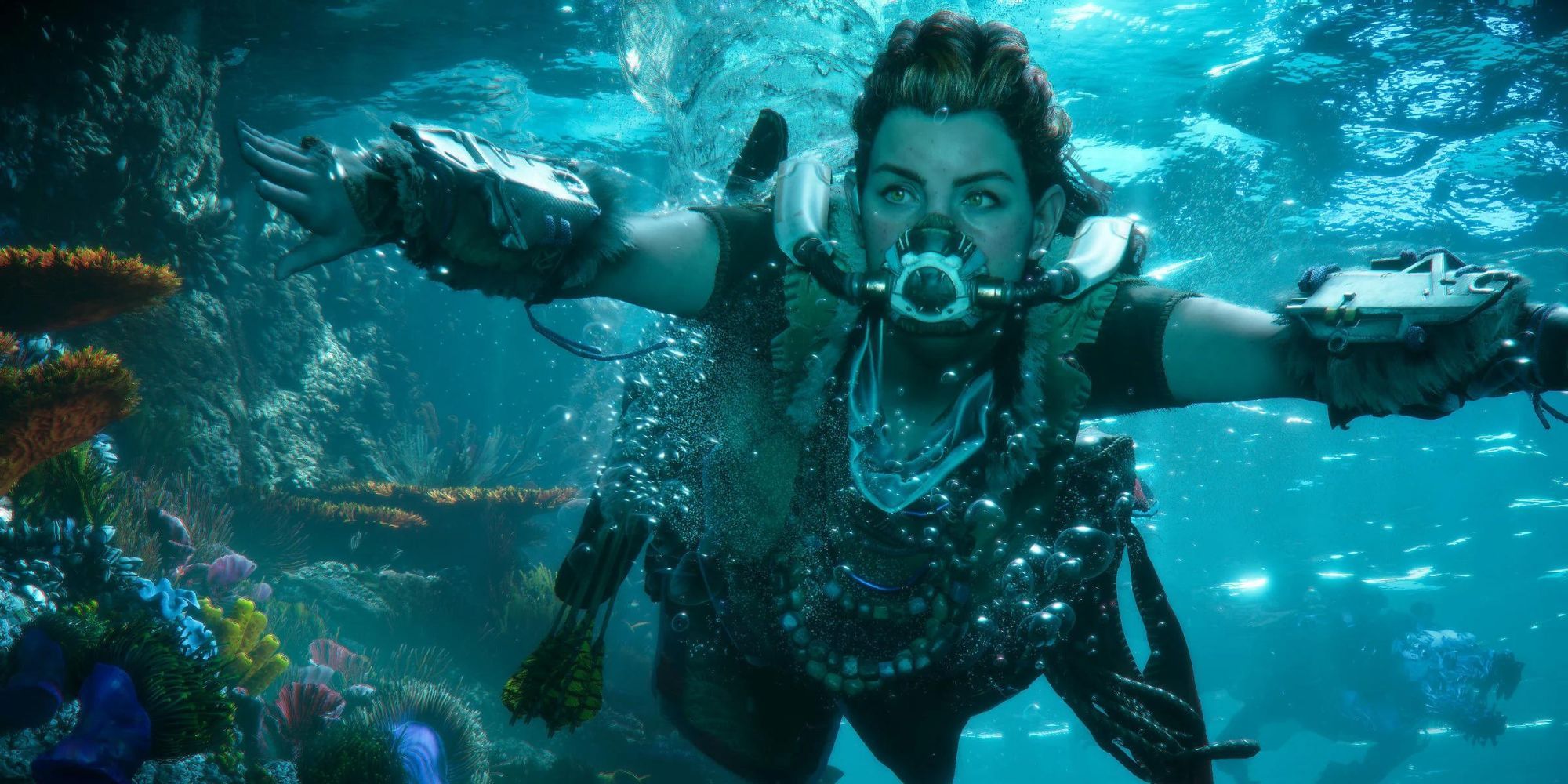 Aloy swimming past a giant reef with a breathing mask on in Forbidden West.