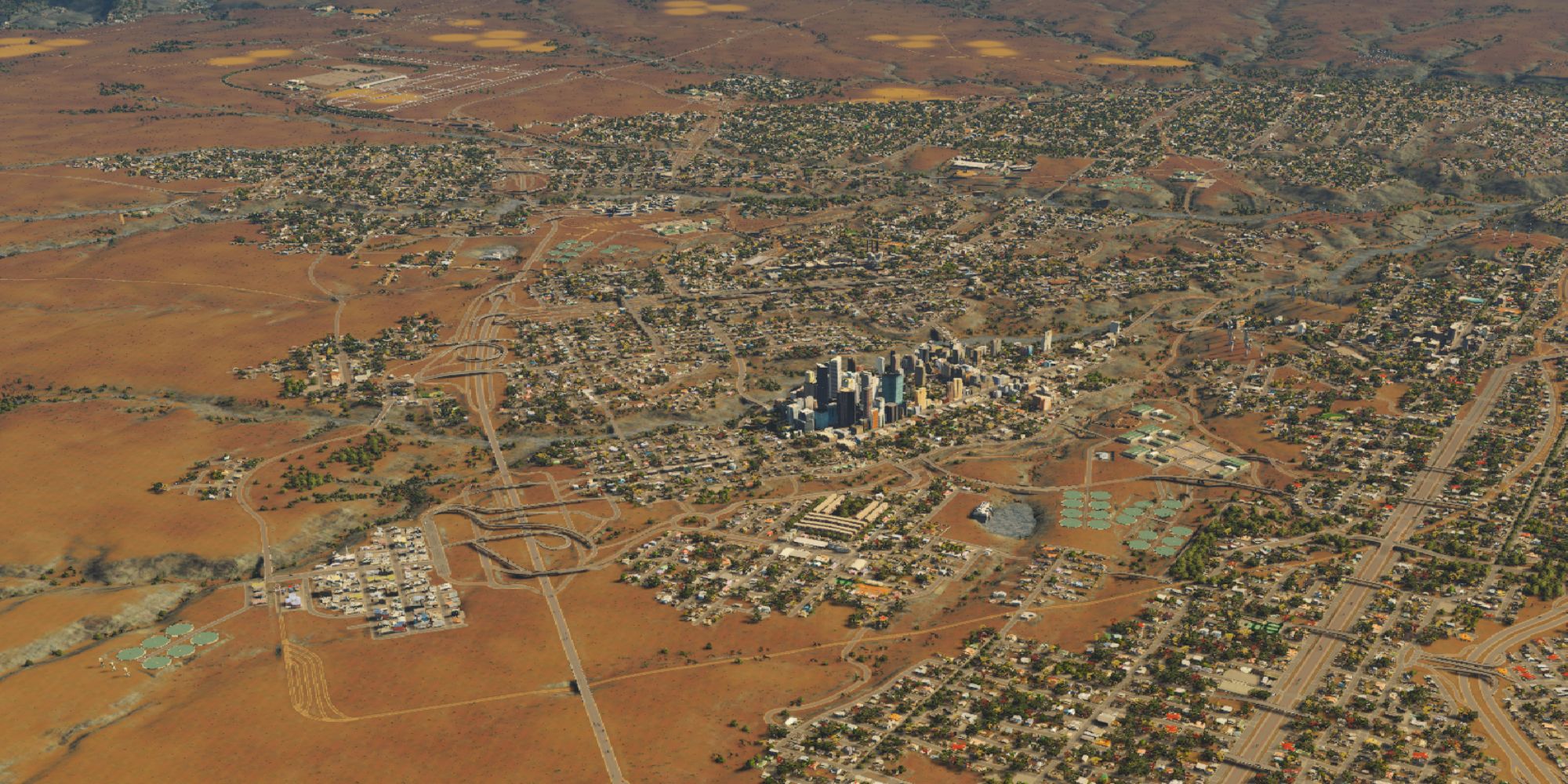 An image of a sprawling city in the middle of a desert from Cities: Skylines. This image captures many different aspects of this sprawling metropolis. 