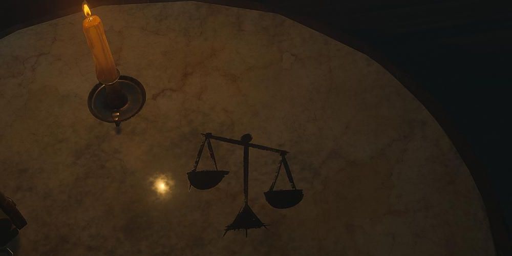 the decision scales icon on a candlelit table in layers of fear 2023
