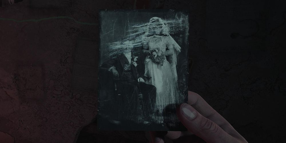 the painter and the musician's wedding photo in layers of fear 2023.  both faces are scratched out.