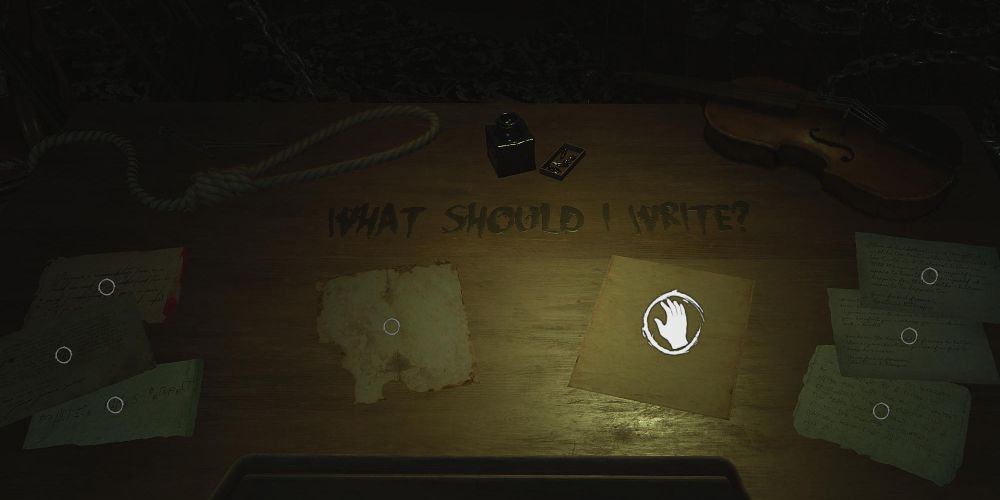 a table in layers of fear 2023: the final note, with several letters, a noose, and a violin.  The words "what should I write?" are scrawled on the table in black ink.