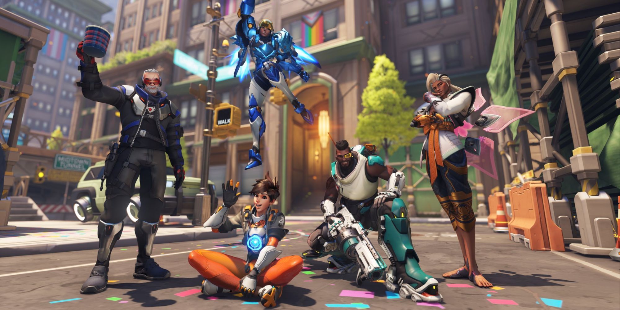 All of the queer characters in Overwatch standing in a pride parade. From left to right: Soldier 76, Tracer, Pharah, Baptiste, and Lifeweaver
