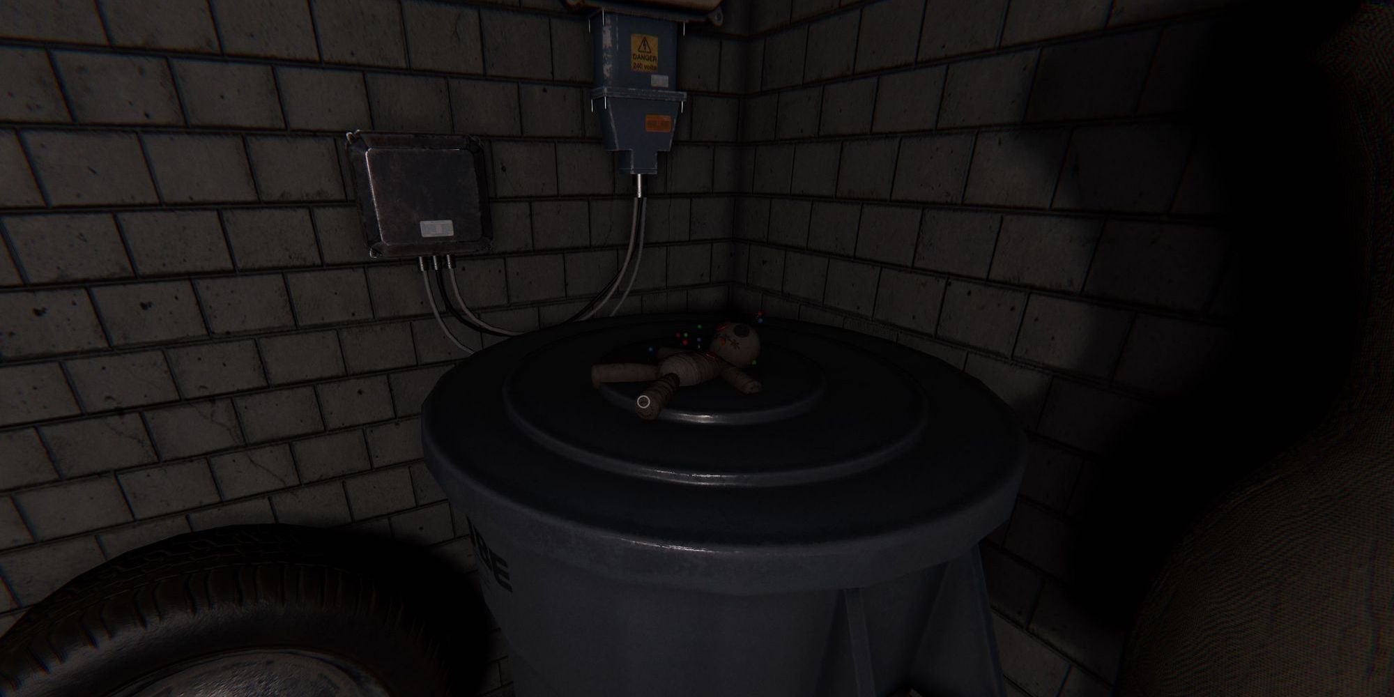 Image depicts a voodoo doll on a plastic container in Tanglewood Drive in Phasmophobia.