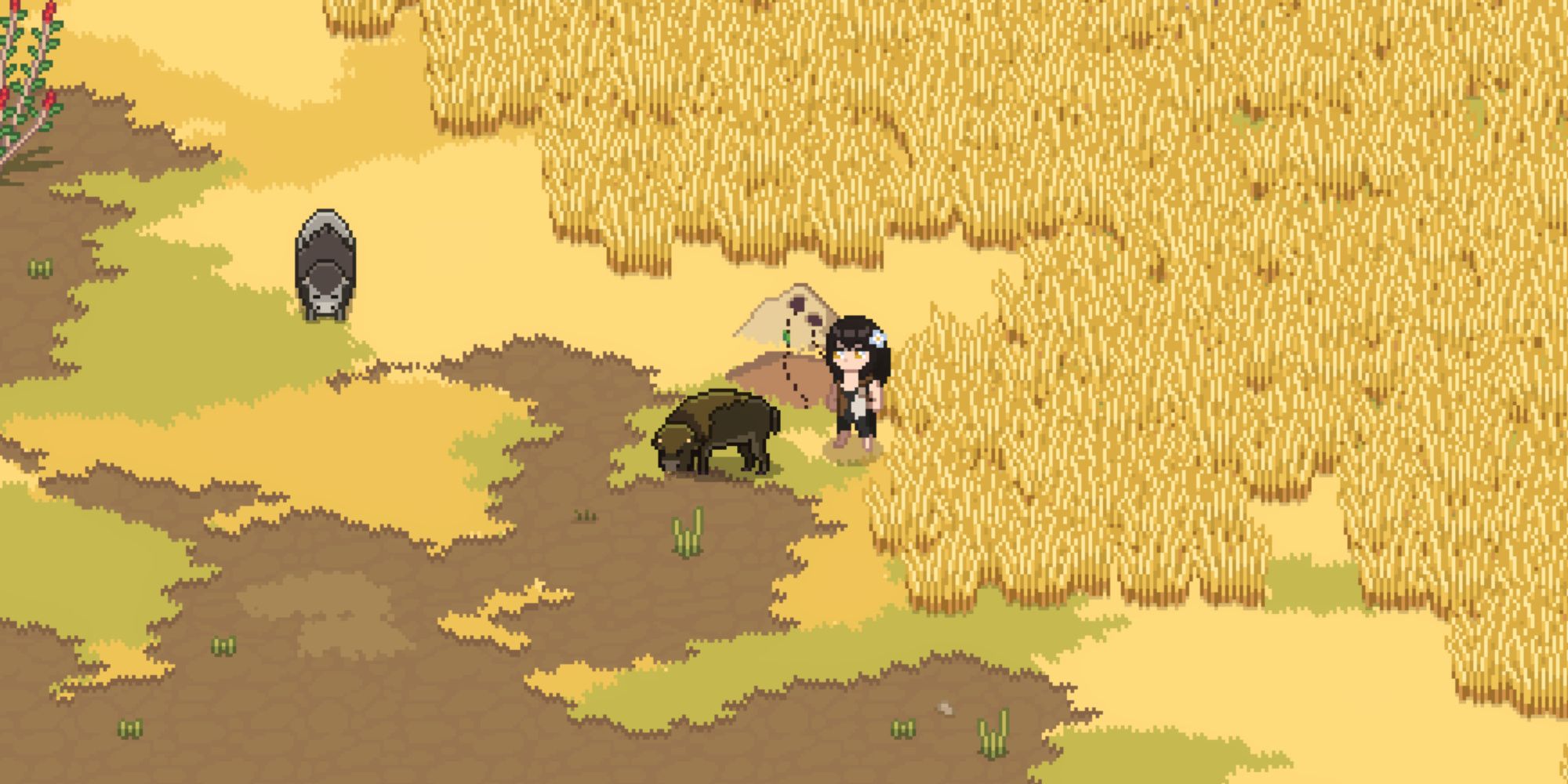 roots of pacha looking at a baby bison in the savanna
