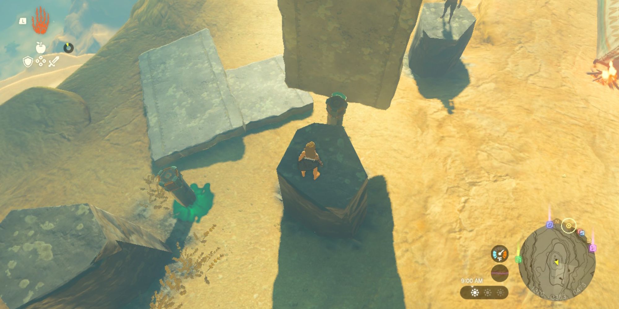 Link stands on a pillar in the desert with makeshift shade.