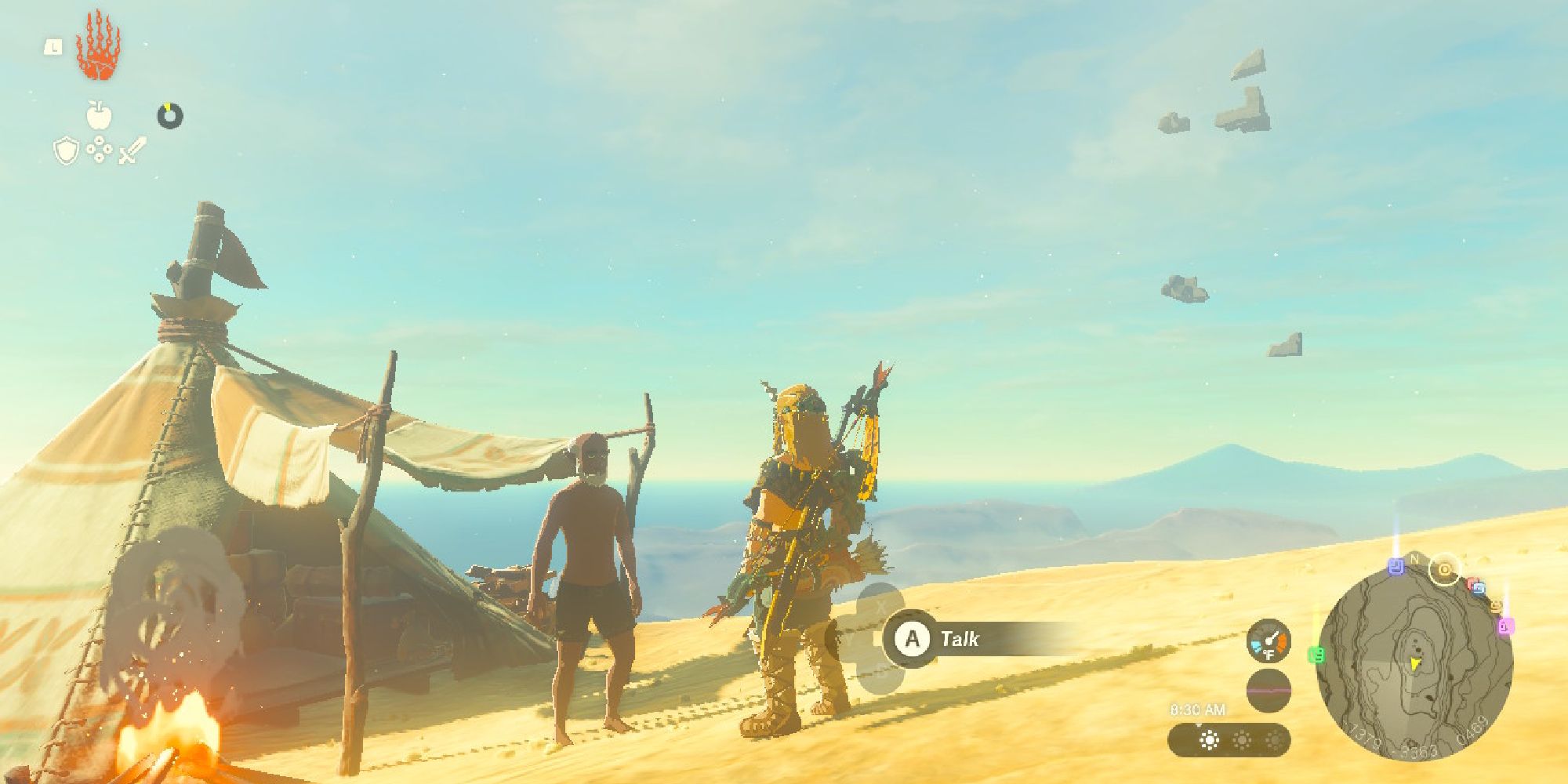 Link talks to a traveler near his tent in the desert.