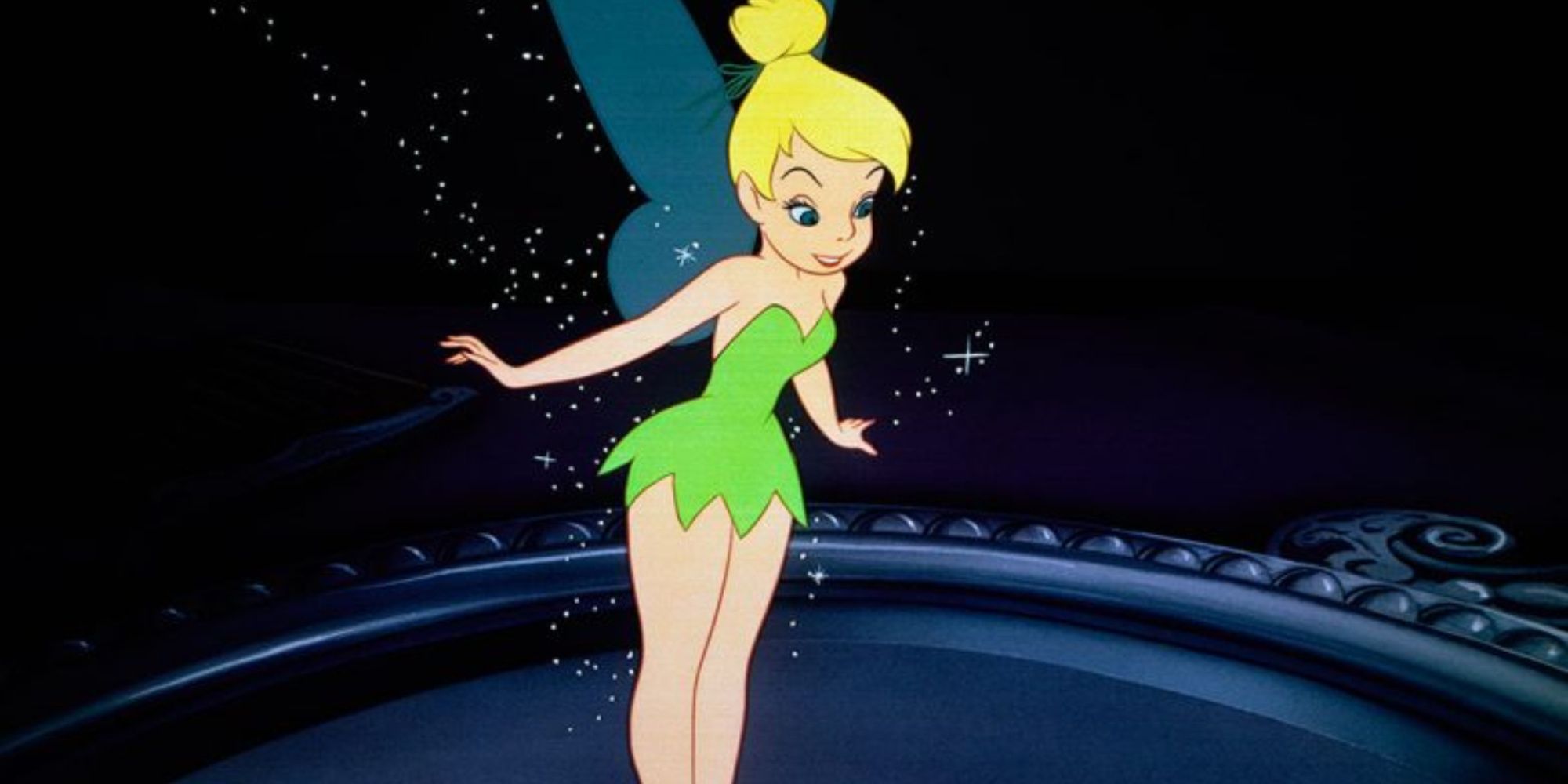 Tinker Bell from Peter Pan animated movie standing on a mirror