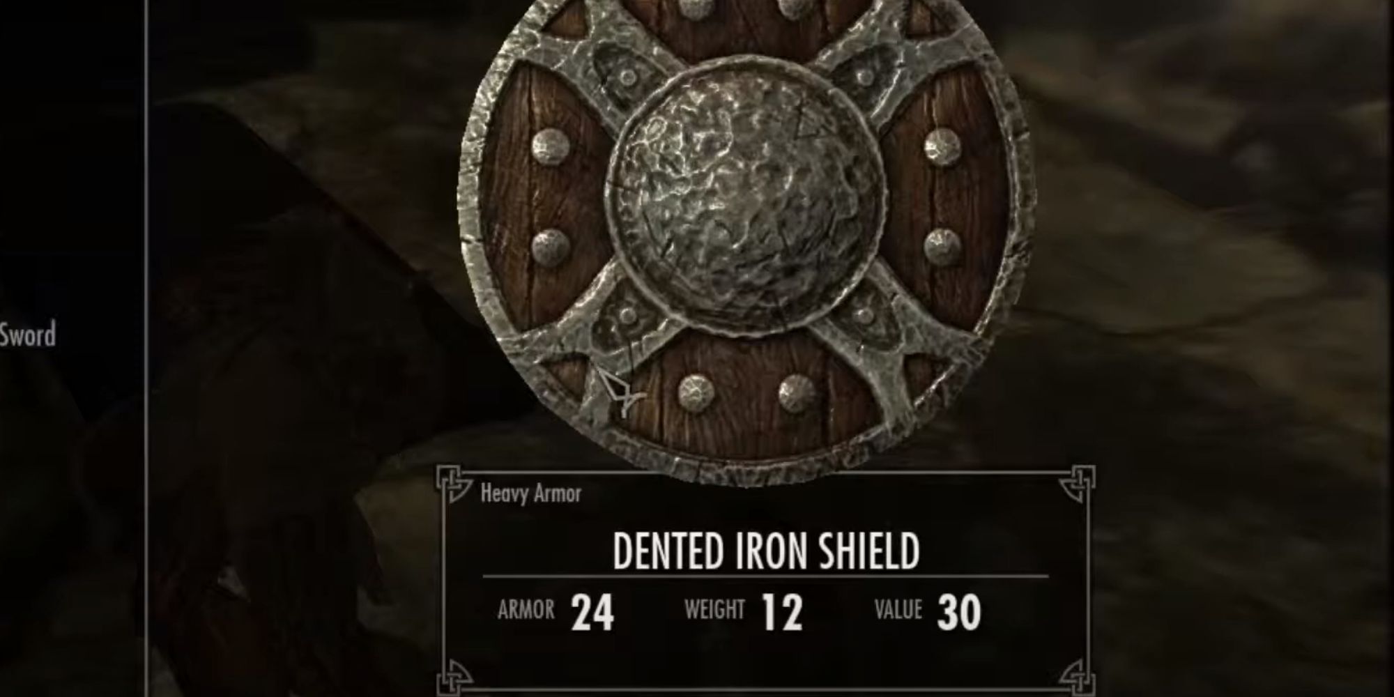 A Dented Iron Shield being looted from a draugr enemy in Skyrim.