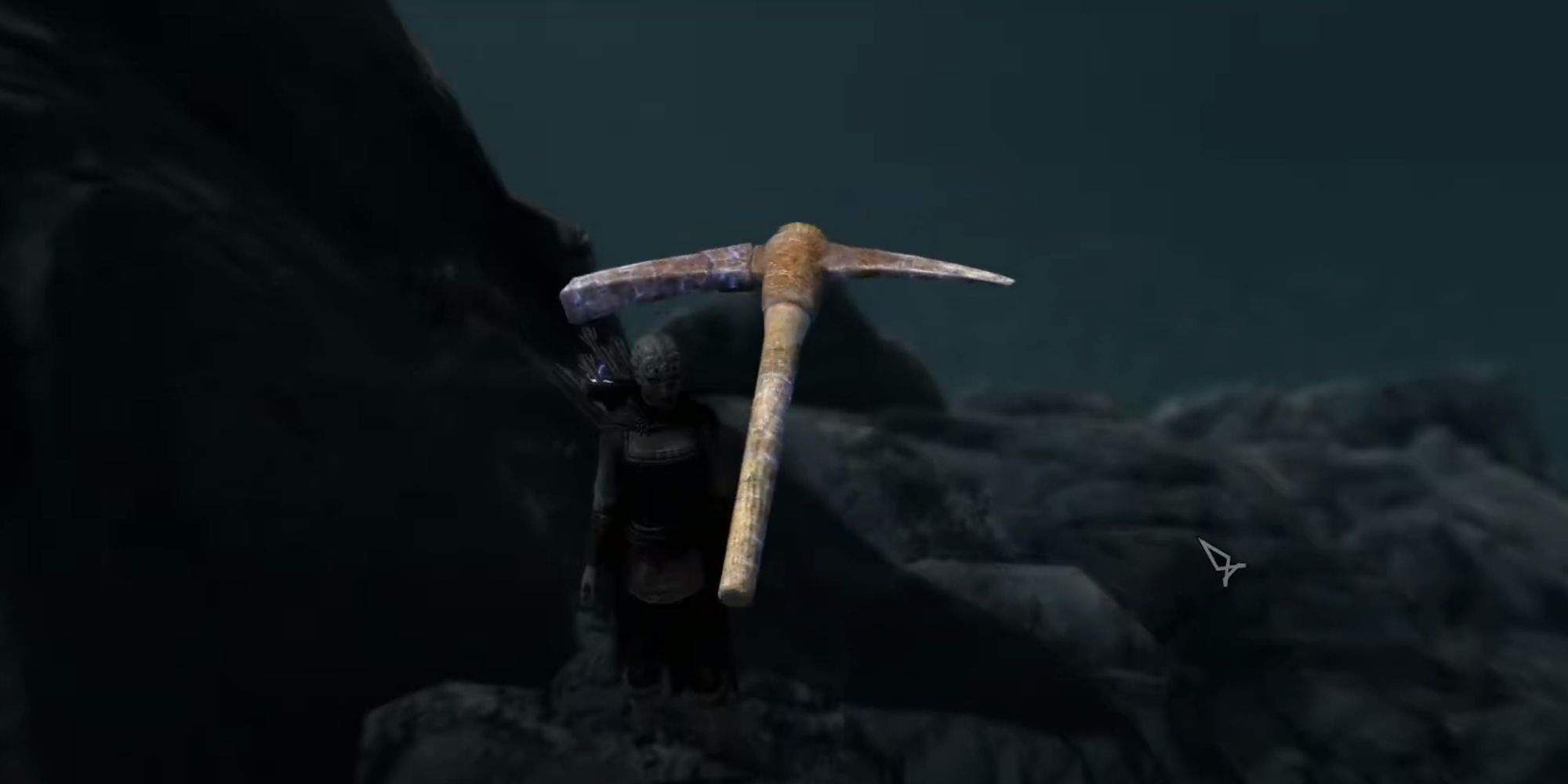 A player inspecting the unique Notched Pickaxe at the top of a mountain in Skyrim.