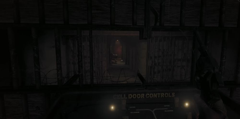 Watching the monster move towards the German prisoner's cell after unlocking it.