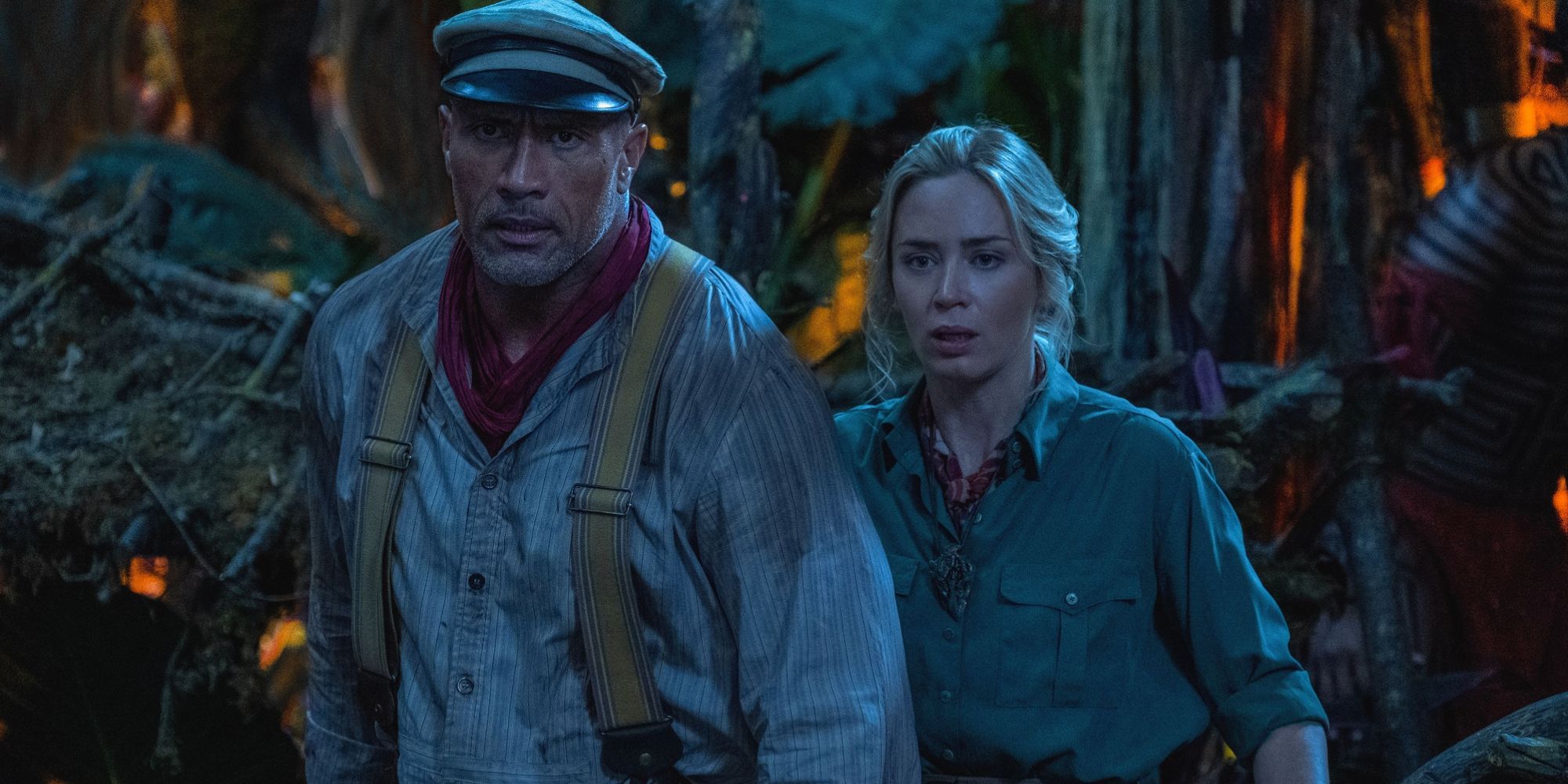 Image of the main characters in a dark foresty area from Jungle Cruise.
