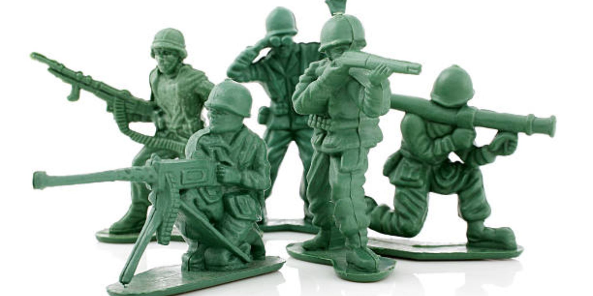 squad of plastic green army men arranged for fighting