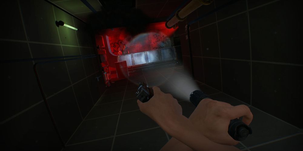 Holding a gun and flashlight in the sewers