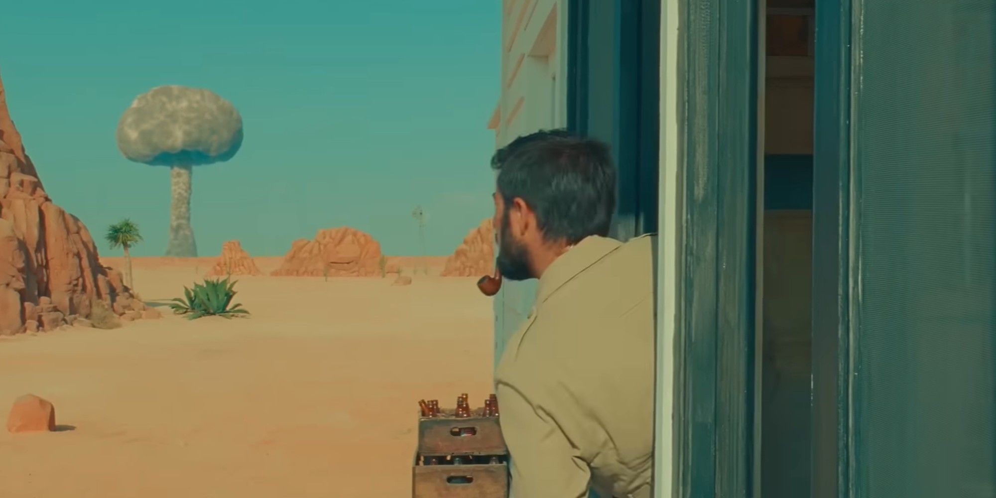 Jason Schwartzman Looking at a mushroom cloud in Asteroid City