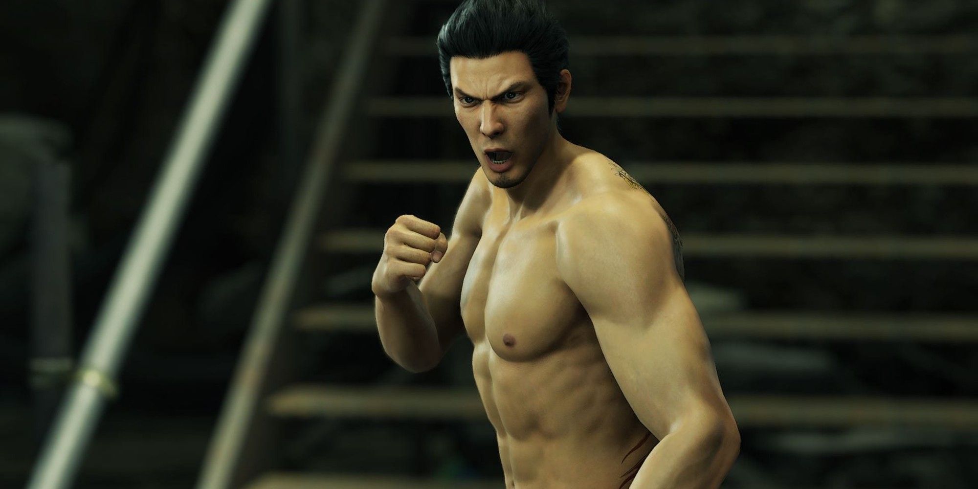 Kazuma Kiryu is shirtless and preparing his fists for battle